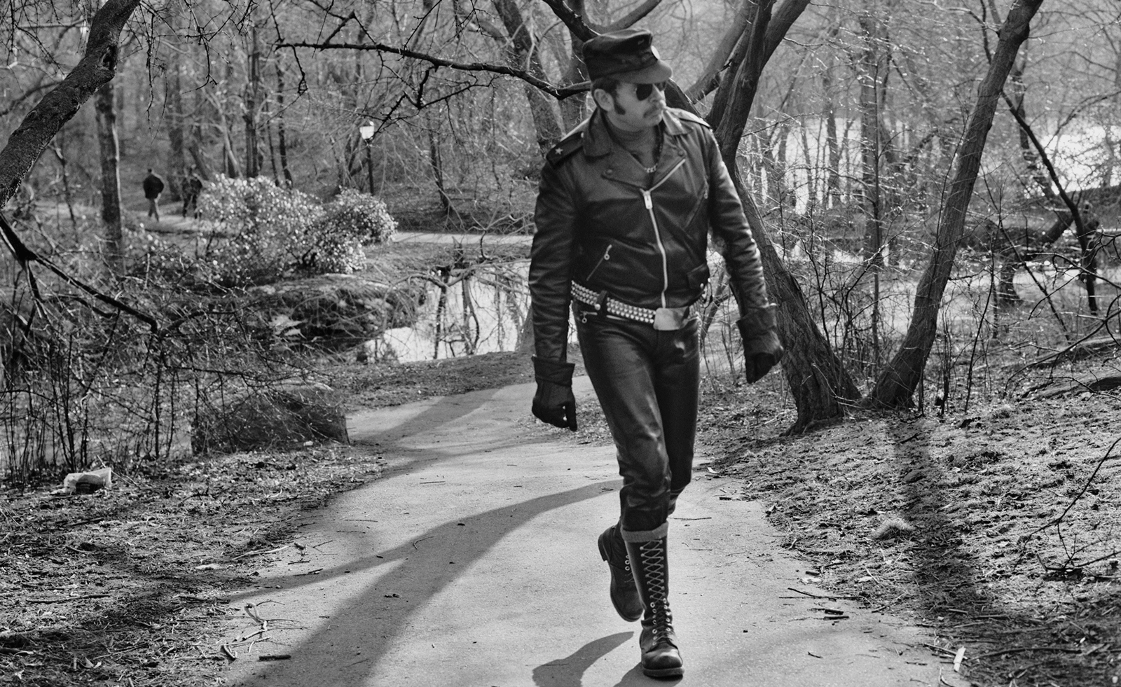 black and white photograph of man in park
