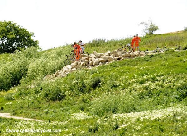 The Polish team inspects the first rock garden on the 2012 Olympic mountain bike course