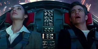 Wonder Woman 1984 Gal Gadot and Chris Pine marveling at fireworks in the invisible jet