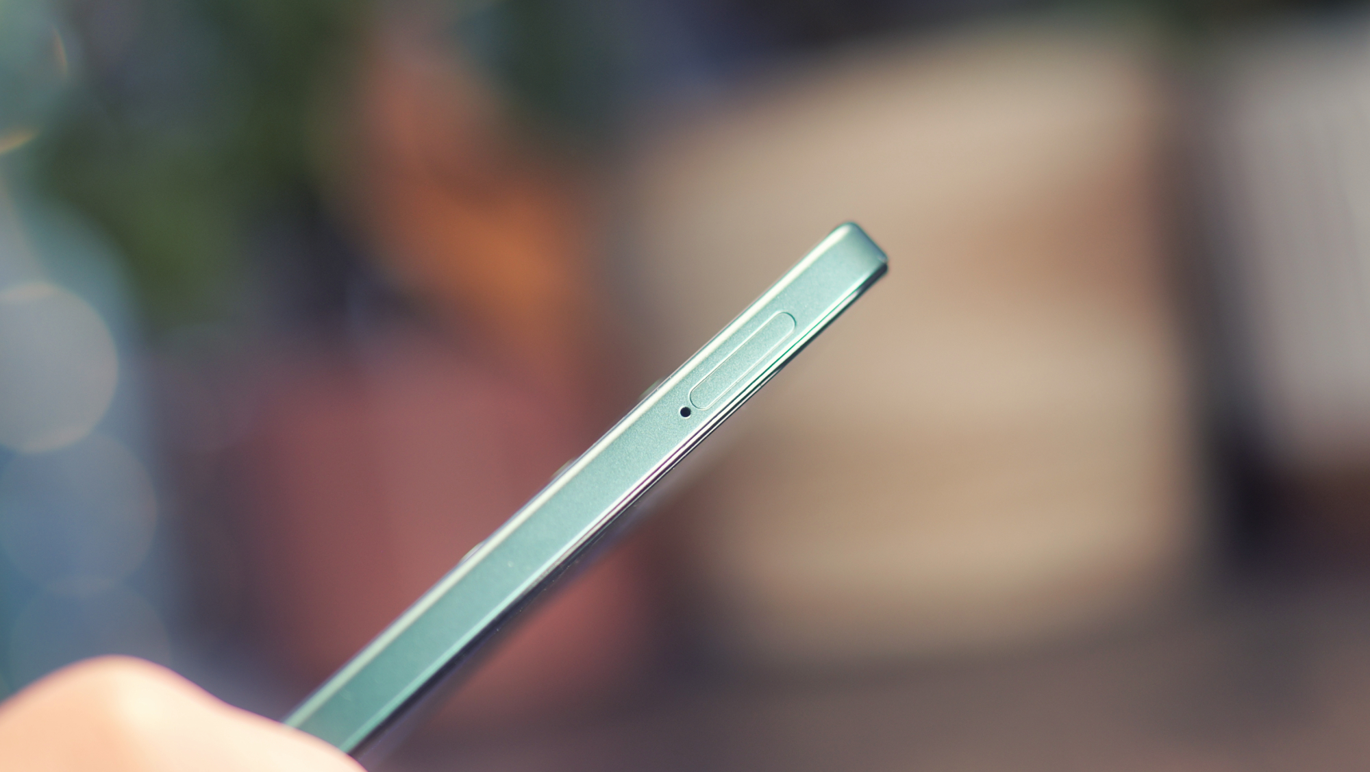 Oppo A5 5G phone held in a hand