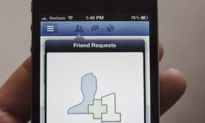 The Facebook app on an iPhone: CEO Mark Zuckerberg is reportedly determined to launch a phone of his own, lest his social network fall behind Google and Apple.