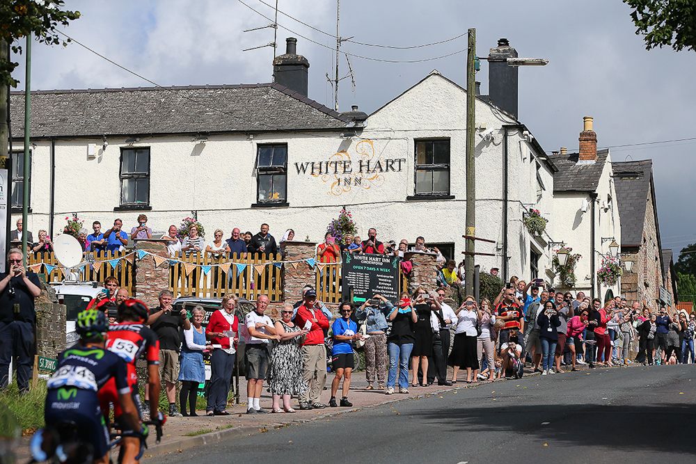 The peloton rolls through a small town during stage 5 at the Tour of Britain