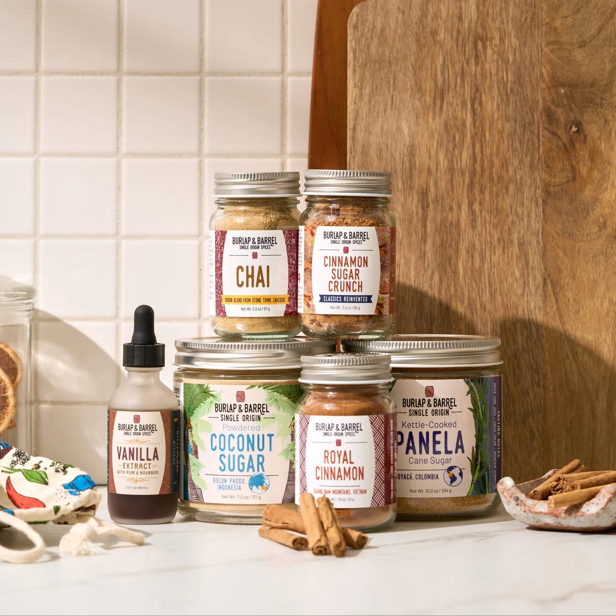 Burlap & Barrel's Sugar Spice and Everything Nice bundle set against a white checkered backsplash