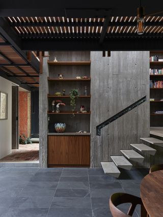 Interior looking towards the staircase at Stockroom Cottage by Architects EAT