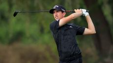 Tom McKibbin hits a fairway wood shot