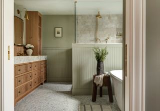 Sage green bathroom with shiplap paneling by Jessica Nelson Interiors, photo Cass photo