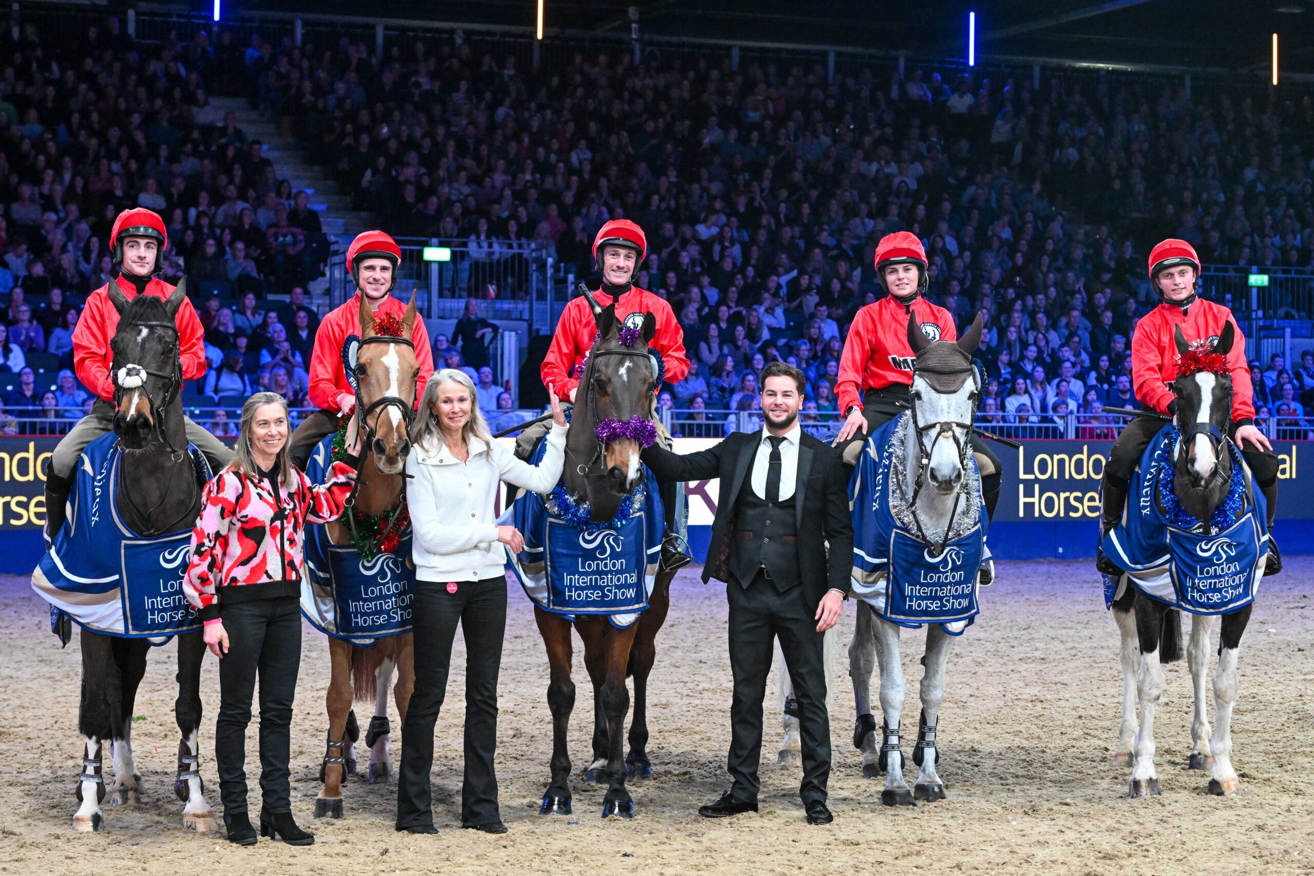 The winning team of L-R: Brian Hughes, Harry Skelton on Billy Angelo, Sam Twiston-Davies, Lilly Pinchen and James Bowen in the Markel Jockeys Jumping in aid of the Injured Jockeys Fund at the London International Horse Show.