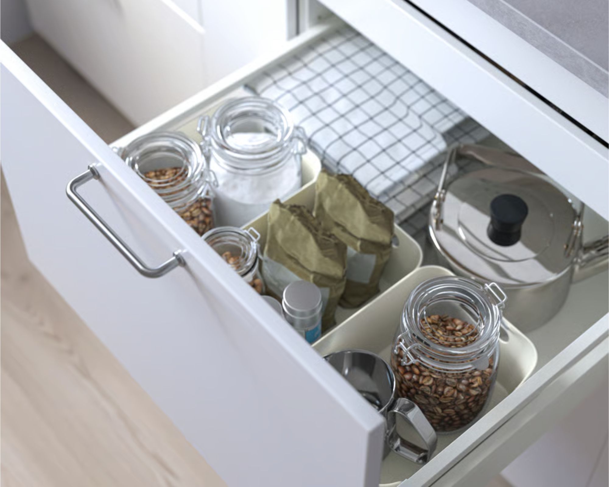 White IKEA UPPDATERA Boxes used to organize a white kitchen drawer