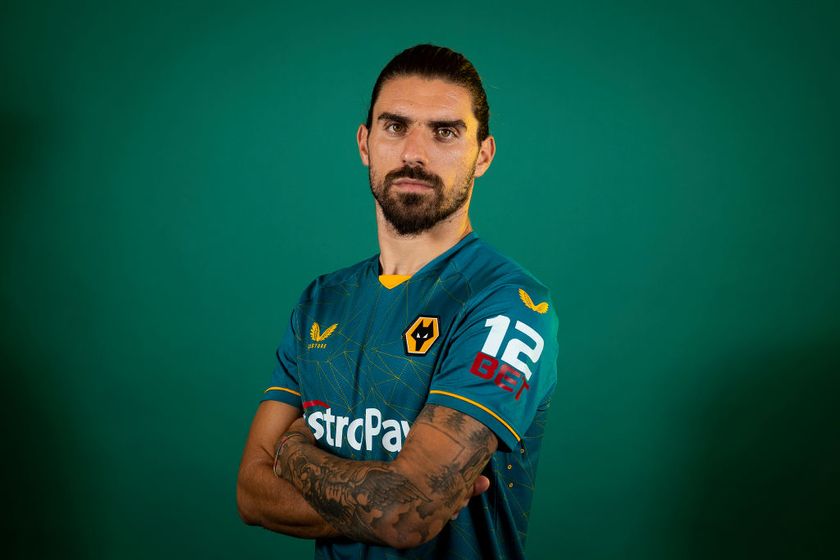 Ruben Neves of Wolverhampton Wanderers poses for a portrait in the Wolverhampton Wanderers Season 2022/23 Away Kit at The Sir Jack Hayward Training Ground on July 08, 2022 in Wolverhampton, England.