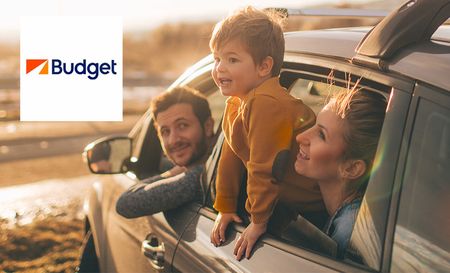 Family sitting in the car rented through Budget rent a car