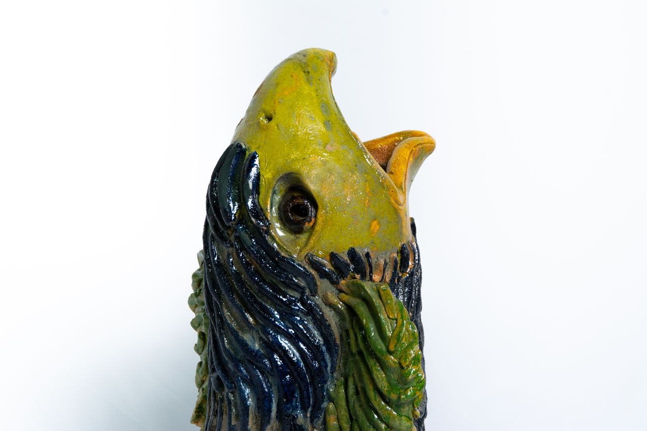 Colourful animal head ceramic vessels