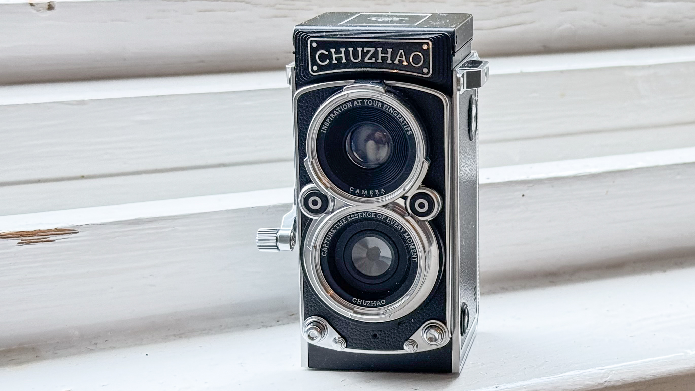 Chuzhao Digital Camera sitting on white window ledge