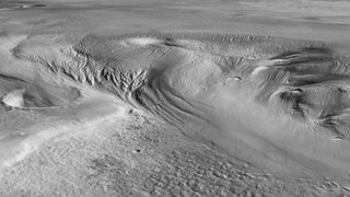 This perspective view shows Eumenides Dorsum, part of Mars’s Medusae Fossae Formation (MFF). The MFF consists of a series of wind-sculpted deposits measuring hundreds of kilometers across and several kilometers high. Found at the boundary between Mars' highlands and lowlands, the deposits are possibly the biggest single source of dust on Mars, and one of the most extensive deposits on the planet.