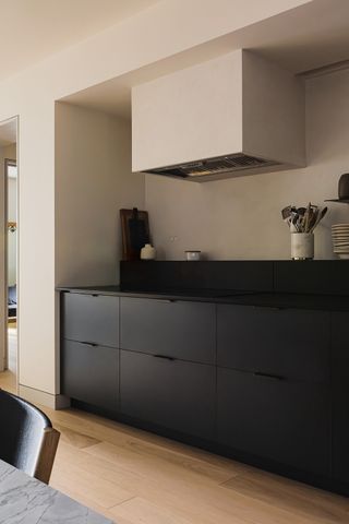 black kitchen with grey walls