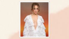 Jennifer Lopez sports a tousled updo and wears a plunge white ruffled gown