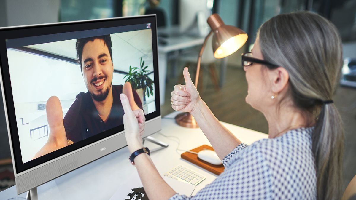 Two business people talking via video conferencing