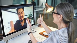 Two business people talking via video conferencing