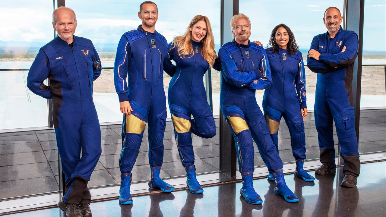Virgin Galactic founder Sir Richard Branson (third from right) will launch on the company's first fully crewed flight on July 11, 2021 as part of a six-person crew. They are (from left): Pilot Dave Mackay; Coplin Bennet, lead operations engineer; Beth Moses, chief astronaut instructor; Branson; Sirisha Bandla, vice president of government affairs and research operations; and pilot Michael Masucci.