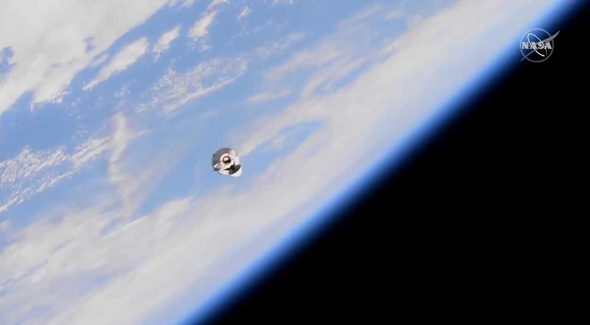 SpaceX's Dragon cargo ship docks at space station in time for astronaut's birthday