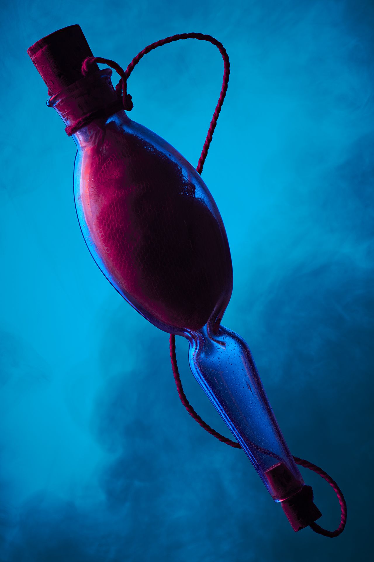 Clinical glass vessel with stoppers photographed in abstract way for 'unfamiliar' at the royal college of physicians museum in london, by theo deproost