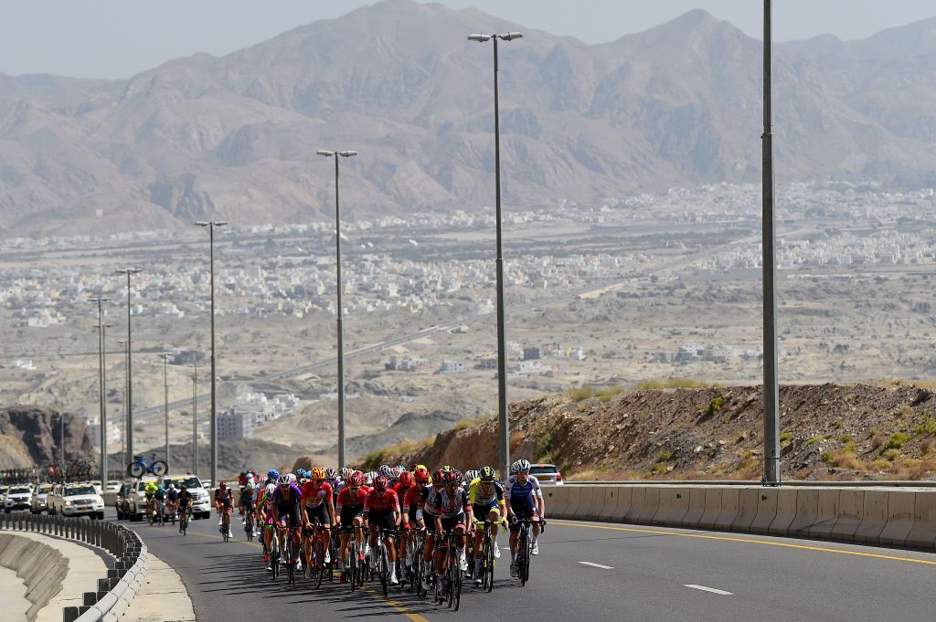 MUSCAT OMAN FEBRUARY 13 A general view of the peloton compete during the 11th Tour Of Oman 2022 Stage 4 a 1195km stage from Al Sifah to Mucat TourofOman on February 13 2022 in Muscat Oman Photo by Dario BelingheriGetty Images