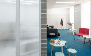 Internal divisions of ribbed glass separate the dentist’s rooms and the corridors