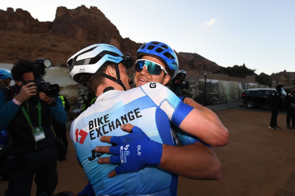 ALULA SAUDI ARABIA FEBRUARY 03 Dylan Groenewegen of Netherlands and Team BikeExchange Jayco celebrate victory by hugging their teammate Alexander Edmondson of Australia during the 6th Saudi Tour 2022 Stage 3 a 1812 km stage from Tayma Hadaj Well to AIUIa Old Town SaudiTour on February 03 2022 in AIUIa Saudi Arabia Photo by Tim de WaeleGetty Images