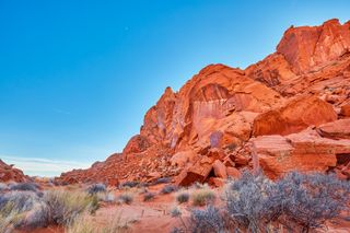 Nevada canyon in Las Vegas with desert foliage and a bright blue sky.