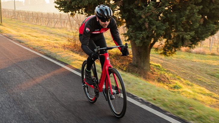 Man riding Ducati Futa e-bike on a road