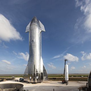 SpaceX's Starship Mk1 prototype (left) stands next to one of the Falcon 1 rocket first stages at the company's South Texas site.