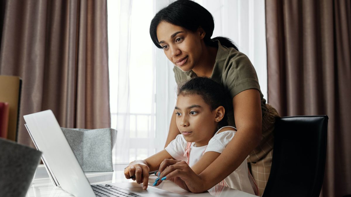 Parent and child on a laptop