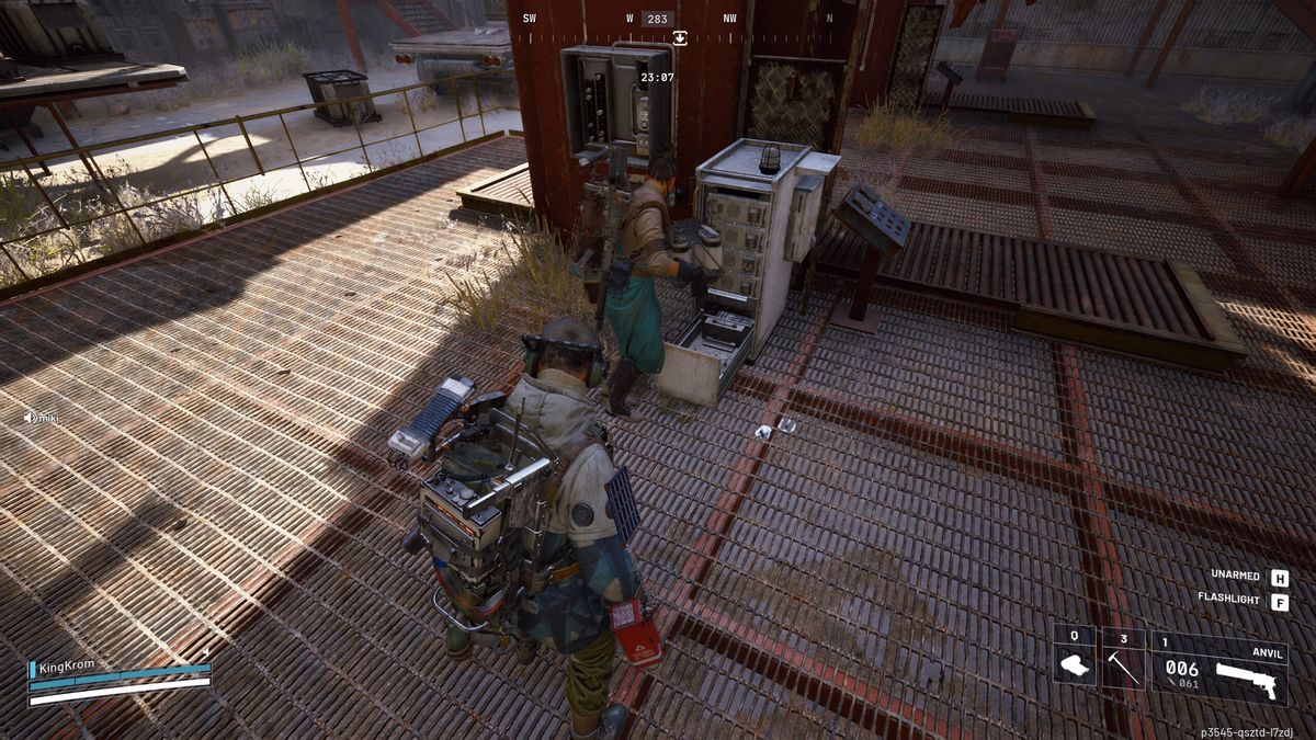 Arc Raiders Worth Your Salt: A player looking at another player placing a battery in the charging machine.