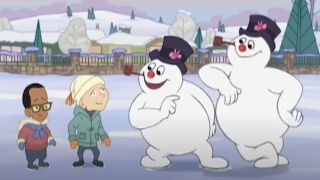 Frosty talks to two boys while standing next to a fake Frosty