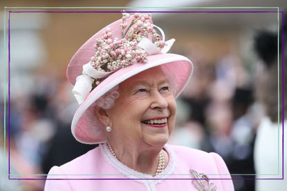 Queen Elizabeth II smiling and looking at the sky