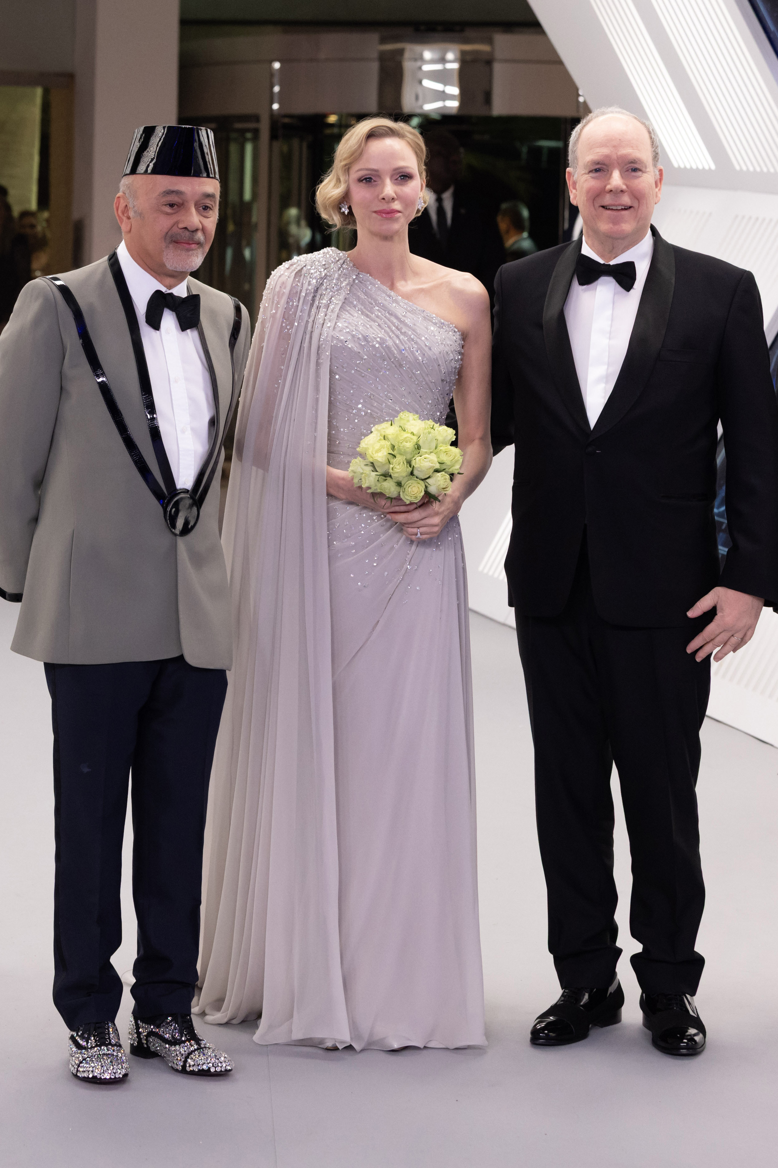 Princess Charlene of Monaco attends the Rose Ball 2026 Photocall on March 21, 2026 wearing a glittering sequin caped gown from Elie Saab