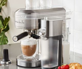 KitchenAid espresso machine in silver on the countertop