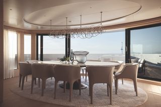 Dining area on the upper deck, featuring the Mizar dining table and Diana armchairs