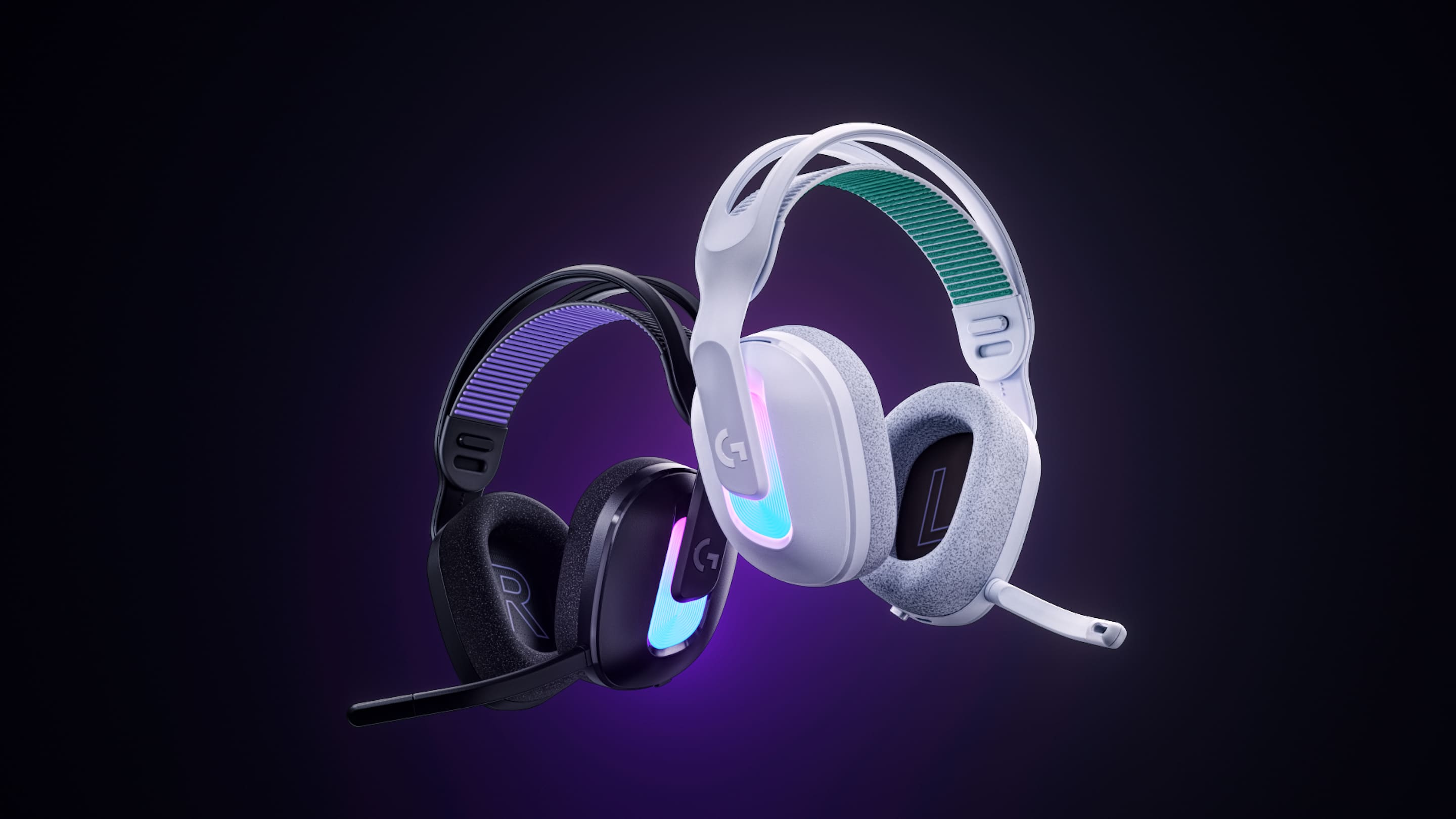 Two pairs of Logitech G522 Wireless headsets on a purple-black background. One headset is black, the other white.