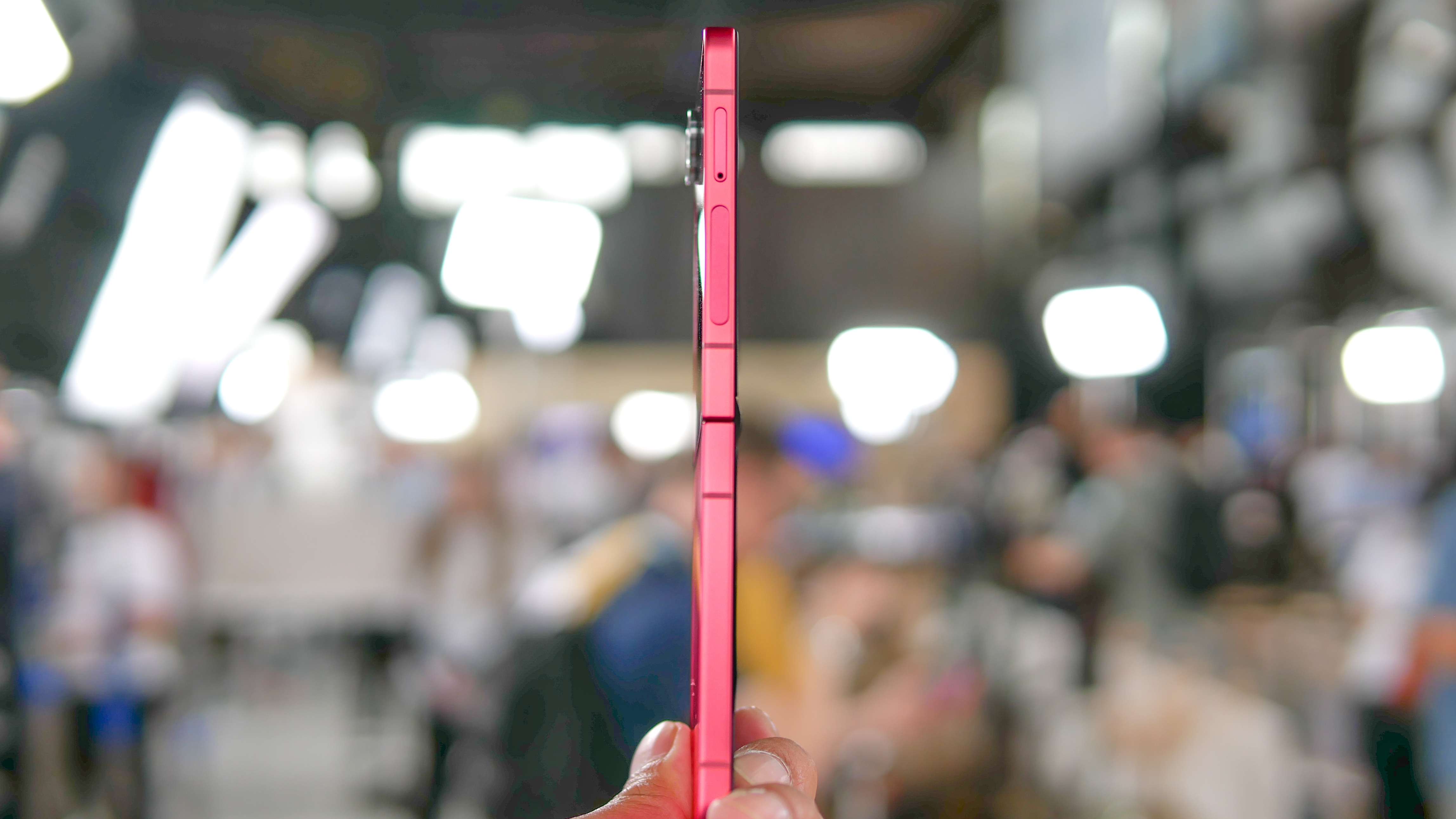Samsung Galaxy Z Flip 7 held in the hand to show its thinness.