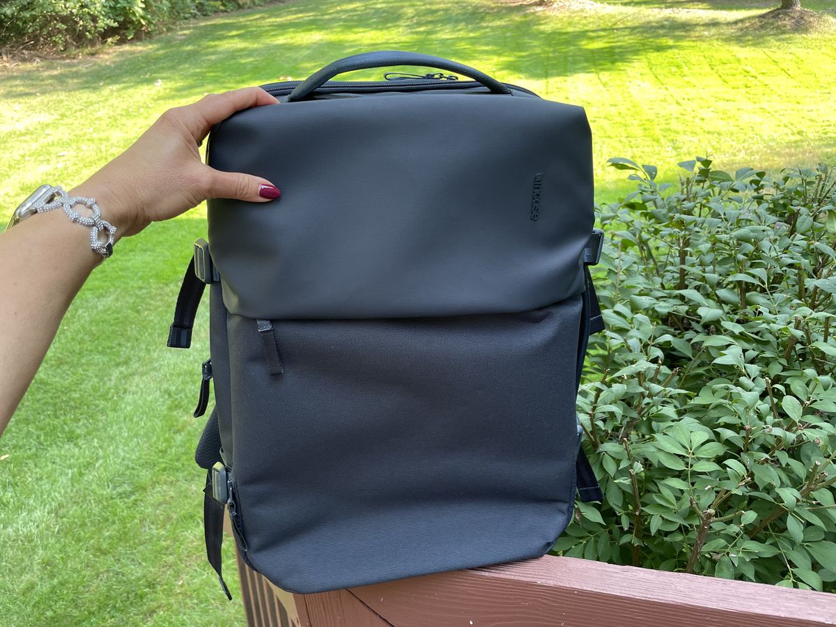 Incase Travel Pack Lifestyle Front View On Railing