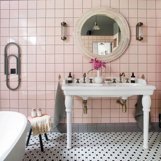 bathroom with pink flower vase and mirror
