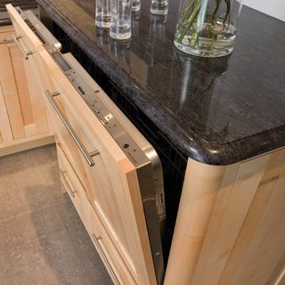 dish washer with wooden and marble worktop