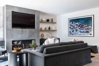 grey living room with fireplace and dark grey couch