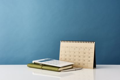 image of a calendar next to a calculator