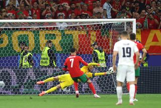 Jan Oblak of Slovenia saves the penalty kick from Cristiano Ronaldo of Portugal during the UEFA EURO 2024 round of 16 match between Portugal and Slovenia at Frankfurt Arena on July 01, 2024 in Frankfurt am Main, Germany. (Photo by Lars Baron/Getty Images)