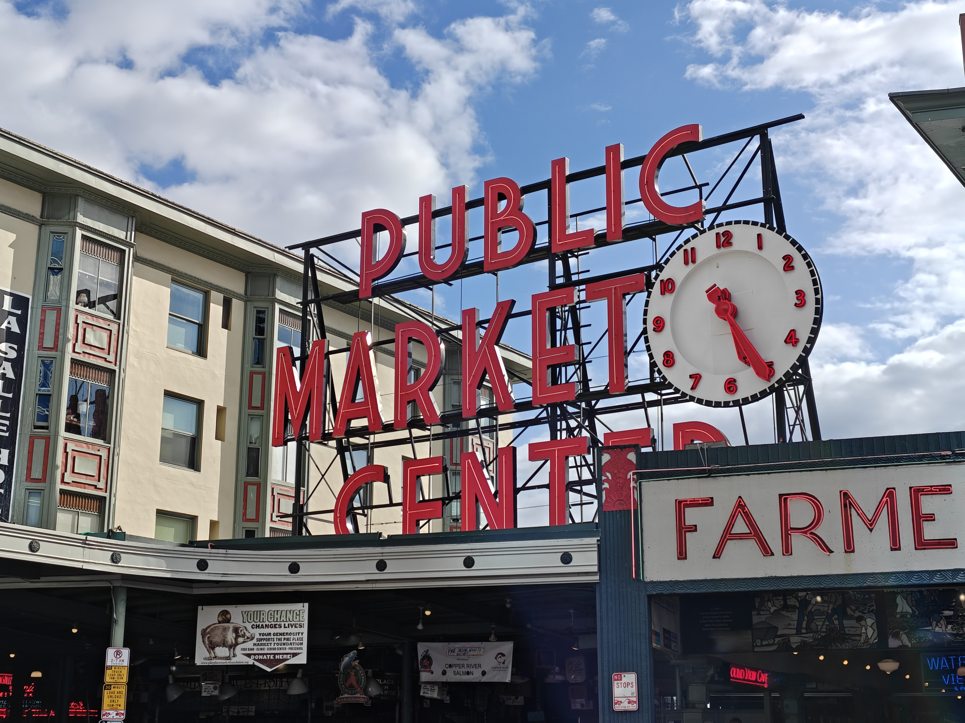 A red Public Market Center sign