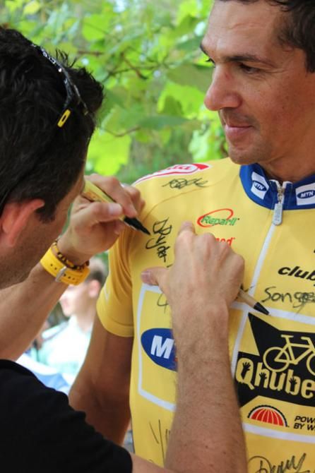 Doug Ryder signs one fan's jersey.