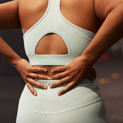 Norwegian 4x4 workout: A woman rests in gym kit after a workout 