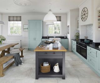 L-shaped kitchen with pale blue units and grey kitchen island