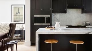 Grey kitchen with marble backsplash and worktop